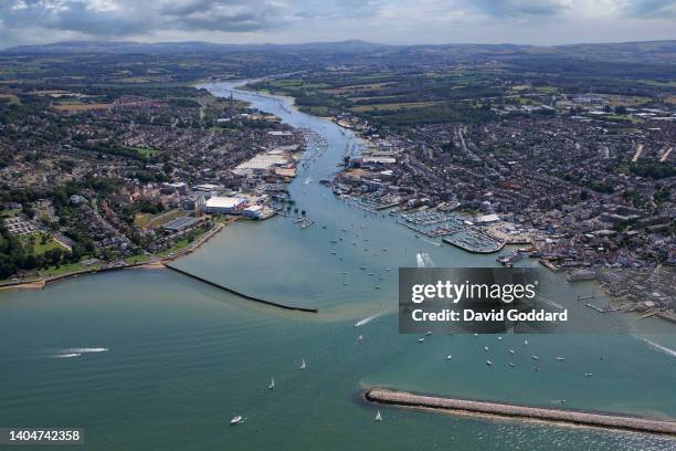 Aerial view of Cowes on the Isle of Wight. This sea port town, famous for yacht racing is located on the west bank of the Medina estuary over looking...