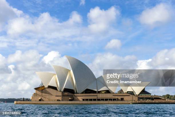 sydney opera house on sunny day, background with copy space - sydney opera house stock pictures, royalty-free photos & images