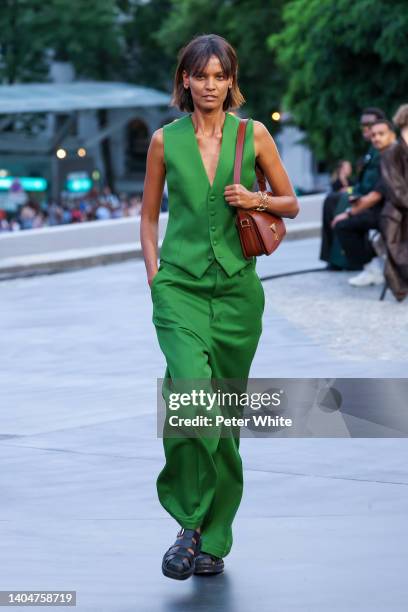 Liya Kebede walks the runway during the AMI - Alexandre Mattiussi Menswear Spring Summer 2023 show as part of Paris Fashion Week on June 23, 2022 in...