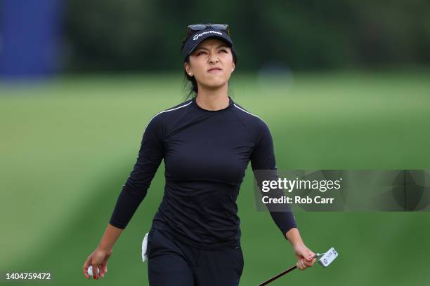 Muni He of China reacts after putting on the seventh green during the first round of the KPMG Women's PGA Championship at Congressional Country Club...