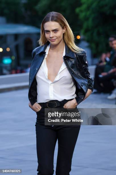 Cara Delevingne walks the runway during the AMI - Alexandre Mattiussi Menswear Spring Summer 2023 show as part of Paris Fashion Week on June 23, 2022...