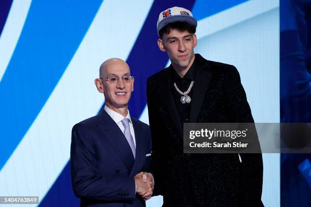 Commissioner Adam Silver and Chet Holmgren pose for photos after Holmgren was drafted with the 2nd overall pick by the Oklahoma City Thunder during...
