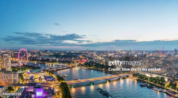 a london skyline panoramic over the river thames from a drone perspective - establishing shot stock pictures, royalty-free photos & images