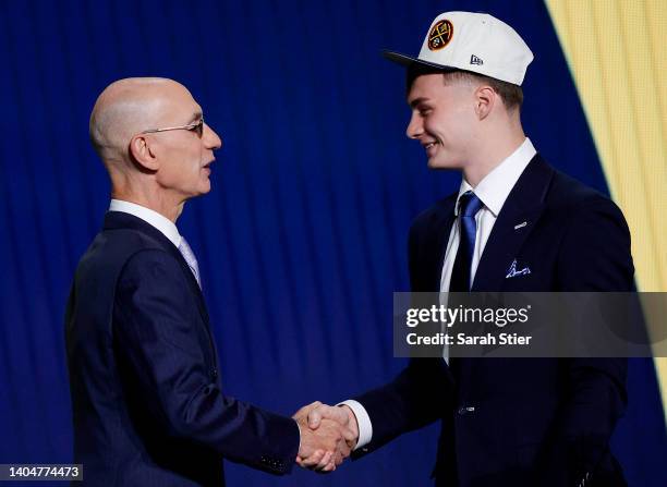 Commissioner Adam Silver and Christian Braun react after Braun was drafted with the 21st overall pick by the Denver Nuggets during the 2022 NBA Draft...