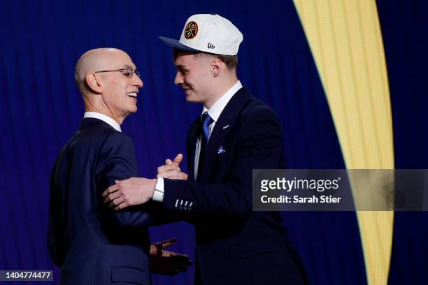 Commissioner Adam Silver and Christian Braun react after Braun was drafted with the 21st overall pick by the Denver Nuggets during the 2022 NBA Draft...