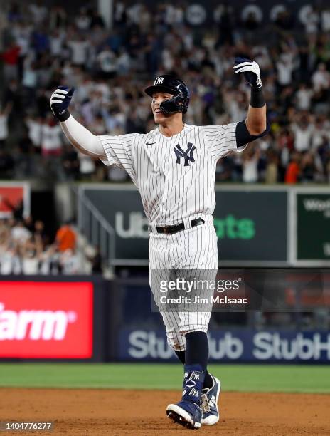 Aaron Judge of the New York Yankees celebrates his ninth inning game winning base hit against the Houston Astros at Yankee Stadium on June 23, 2022...