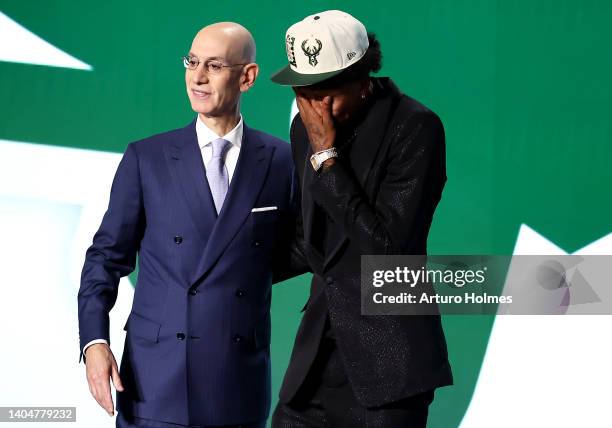 Commissioner Adam Silver and MarJon Beauchamp react after Beauchamp was drafted with the 24th overall pick by the Milwaukee Bucks during the 2022 NBA...