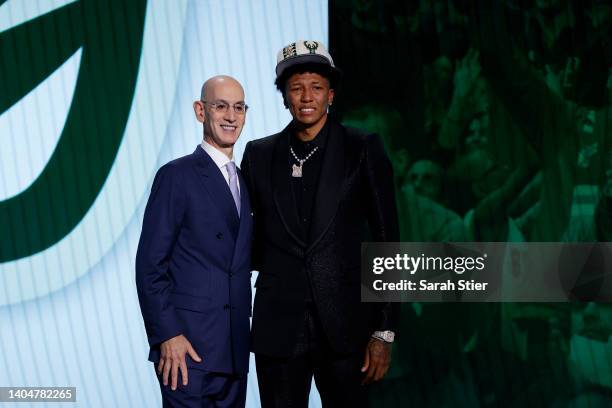 Commissioner Adam Silver and MarJon Beauchamp pose for photos after Beauchamp was drafted with the 24th overall pick by the Milwaukee Bucks during...