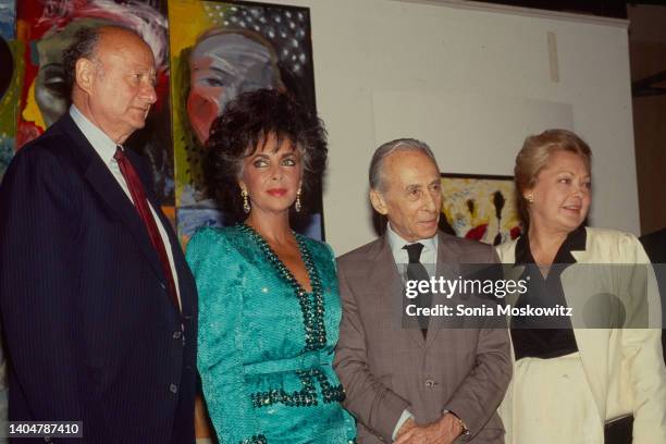 View of, from left, New York City Mayor Ed Koch , actress Elizabeth Taylor , art dealer Leo Castelli , and researcher & American Foundation for AIDS...