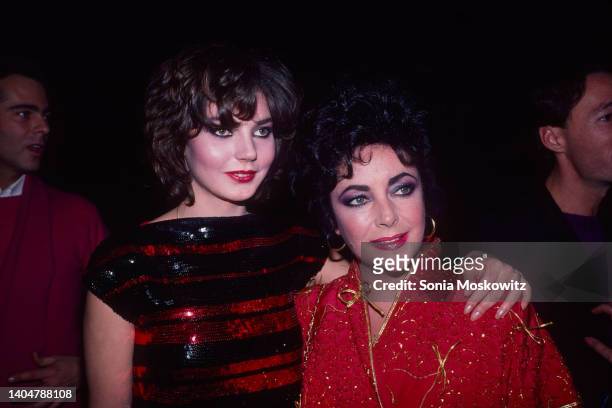 View of Maria Burton and her adoptive mother, actress Elizabeth Taylor as they attend an unspecified event at the Roxy Roller Rink, New York, New...