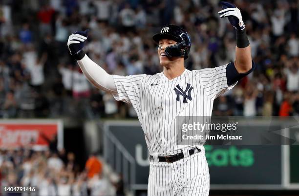 Aaron Judge of the New York Yankees celebrates his ninth inning game winning base hit against the Houston Astros at Yankee Stadium on June 23, 2022...