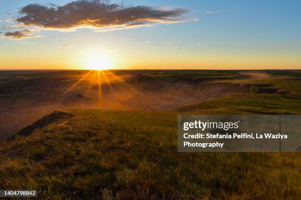 badlands national park at golden hour - grass land stock pictures, royalty-free photos & images