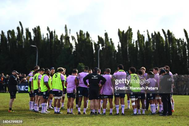 The All Blacks huddle during a training session at Kerikeri Rugby Ground on June 24, 2022 in Kerikeri, New Zealand.