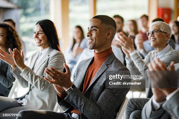 applauding on a business seminar! - applauding stock pictures, royalty-free photos & images