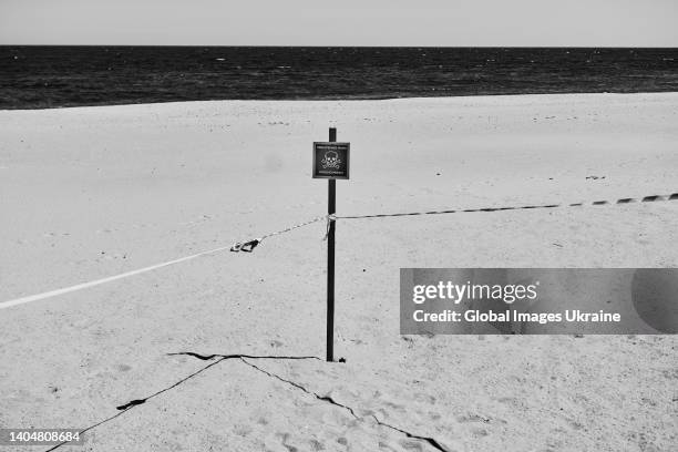Sign that reads “Caution: mines” is taped a beach on May 27, 2022 in Odesa, Ukraine. Ukrainian forces, as well as civilians from Odesa, remain on...