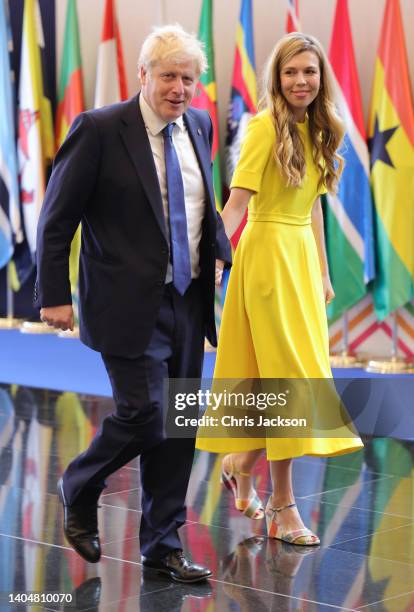 Prime Minister Boris Johnson and his wife Carrie Johnson attend the CHOGM opening ceremony at Kigali Convention Centre on June 24, 2022 in Kigali,...