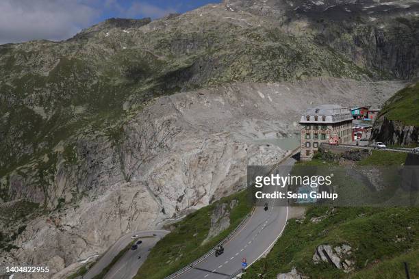 The shuttered Hotel Belvedere stands next to a moraine that shows where the Rhone glacier once descended on June 23, 2022 near Gletsch, Switzerland....