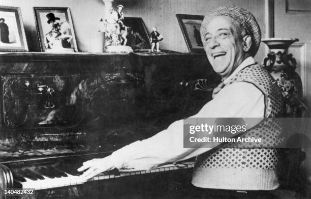 English cockney music hall entertainer Harry Champion at the piano, circa 1935. Champion is best known for his recordings of songs such as 'Boiled...