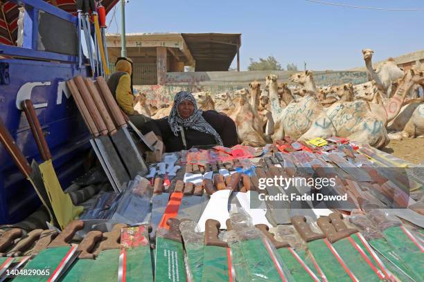 Woman sells knives and sickles at the Birqash Camel Market, ahead of the Muslim festival of sacrifice Eid al-Adha. June 24, 2022 in Giza, on Cairo,...