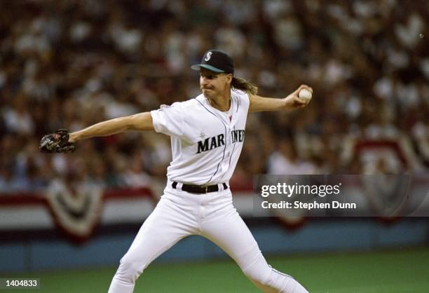 Pitcher Randy Johnson of the Seattle Mariners prepares to throw the ball during a game against the New York Yankees at the Kingdome in Seattle,...