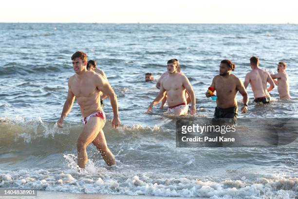 Guy Porter walks from the ocean during an England Rugby Squad beach recovery session at South Beach on June 24, 2022 in Perth, Australia.