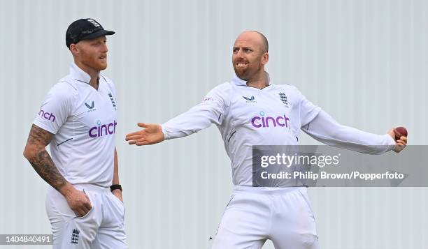 Jack Leach of England warms up to bowl as Ben Stokes looks on during the second day of the third Test between England and New Zealand at Headingley...