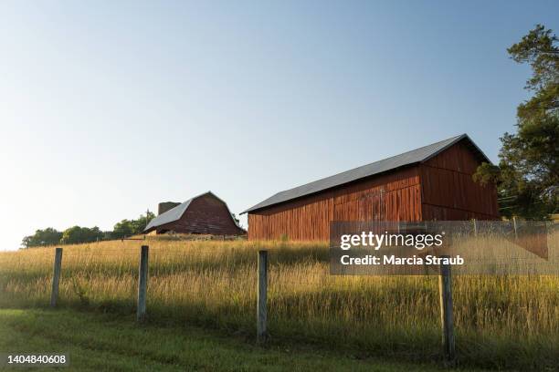 a red barn and old fence - tennessee farm stock pictures, royalty-free photos & images