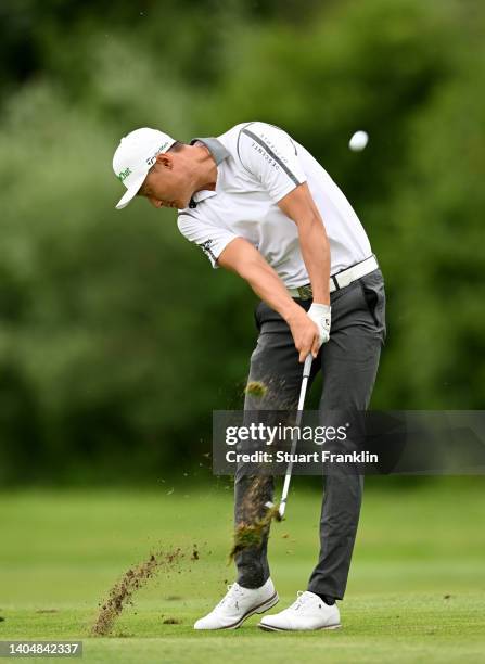 Haotong Li of China plays his second shot on the 13th hole during the second round of the BMW International Open at Golfclub Munchen Eichenried on...