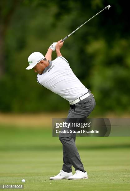 Haotong Li of China plays his second shot on the 14th hole during the second round of the BMW International Open at Golfclub Munchen Eichenried on...