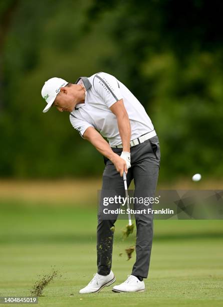 Haotong Li of China plays his second shot on the 14th hole during the second round of the BMW International Open at Golfclub Munchen Eichenried on...