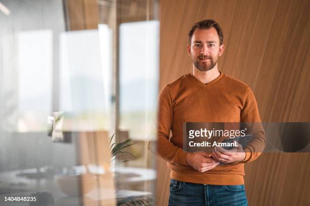 young male finance intern on his first day at work - bovenlichaam stockfoto's en -beelden