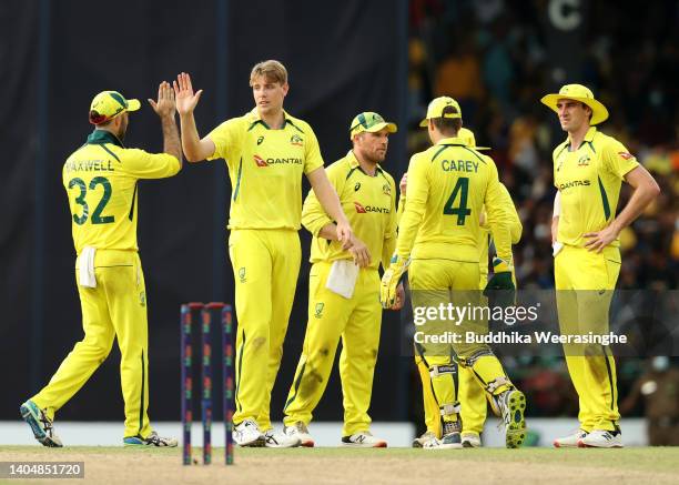 Cameron Green of Australia celebrates with Glen Maxwell after dismissing Pramod Madushan of Sri Lanka during the 5th match in the ODI series between...