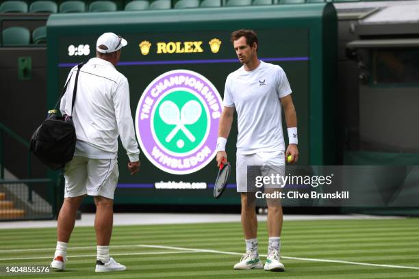 Andy Murray of Great Britain speaks with his coach Ivan Lendl ahead of The Championships Wimbledon 2022 at All England Lawn Tennis and Croquet Club...