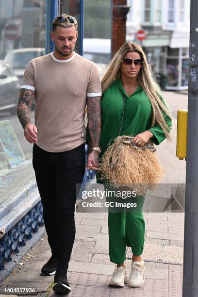 Katie Price and Carl Woods arrive at Lewes Crown Court on June 24, 2022 in Lewes, England. British model and media personality Katie Price is in...