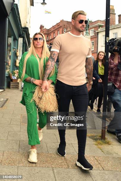 Katie Price and Carl Woods leave Lewes Crown Court on June 24, 2022 in Lewes, England. British model and media personality Katie Price is in court to...