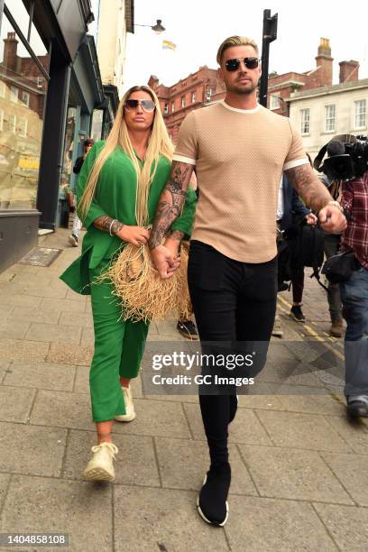 Katie Price and Carl Woods leave Lewes Crown Court on June 24, 2022 in Lewes, England. British model and media personality Katie Price is in court to...