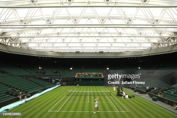 General view on centre court as current World Number One Iga Swiatek of Poland serves during a practice session ahead of The Championships Wimbledon...