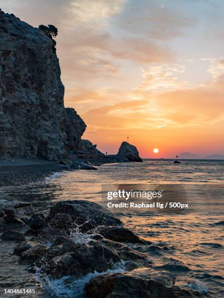 scenic view of sea against sky during sunset - kos stock-fotos und bilder