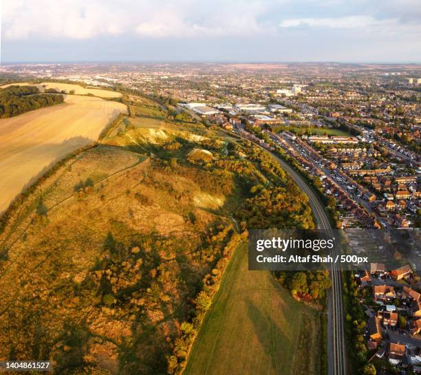 aerial view of british motorways,m1 j11a at luton and british countryside,dunstable,united kingdom,uk - dunstable stock-fotos und bilder