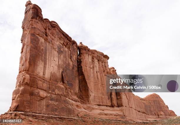 low angle view of rock formation against sky,arches national park,utah,united states,usa - mark colvin stock pictures, royalty-free photos & images