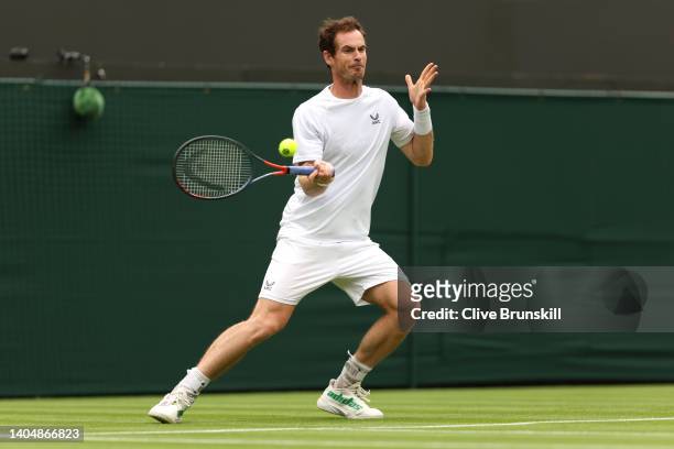 Andy Murray of Great Britain plays a forehand during a practice session ahead of The Championships Wimbledon 2022 at All England Lawn Tennis and...