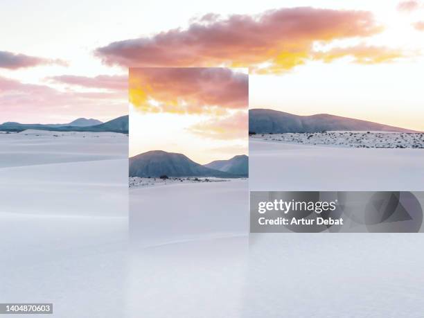 mirror reflecting desert dunes with dramatic sunset sky in the canary islands. - surreal desert stock pictures, royalty-free photos & images