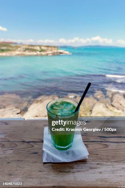 close-up of drink on table against sea,lozenets,bulgaria - krasimir georgiev stock pictures, royalty-free photos & images