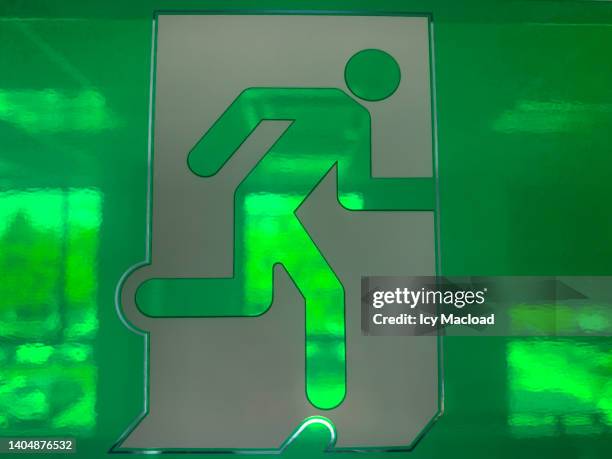 emergency exit sign - appearance icon stock pictures, royalty-free photos & images