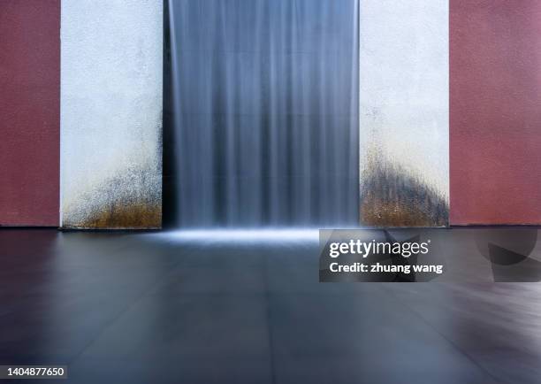 artificial waterfall and wall surface - water fall wall stock pictures, royalty-free photos & images