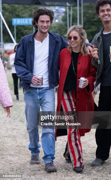 Sienna Miller and Oli Green attend day three of Glastonbury Festival at Worthy Farm, Pilton on June 24, 2022 in Glastonbury, England.