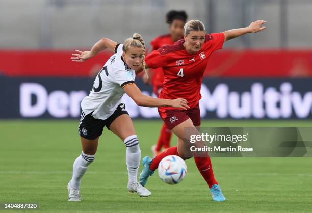 Giulia Gwinn of Germany battles for possession with Rachel Rinast of Switzerland during the Women's International friendly match between Germany and...