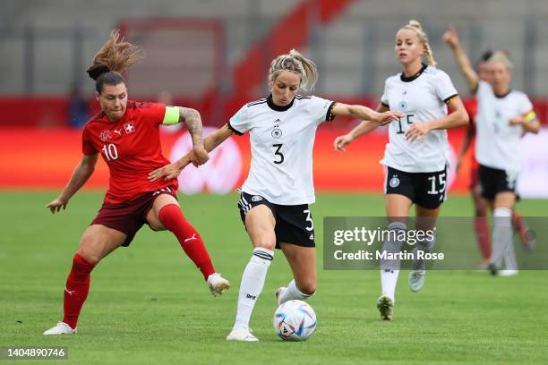 Ramona Bachmann of Switzerland battles for possession with Kathrin Hendrich of Germany during the Women's International friendly match between...