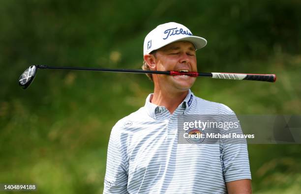 Patton Kizzire of the United States reacts to his tee shot on the 15th tee during the second round of Travelers Championship at TPC River Highlands...