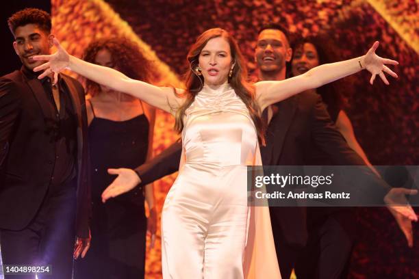 Host Katrin Bauerfeind performs on stage during the 72nd Lola - German Film Award show at Palais am Funkturm on June 24, 2022 in Berlin, Germany.
